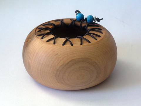 A Maple Bowl With Leather Accent
