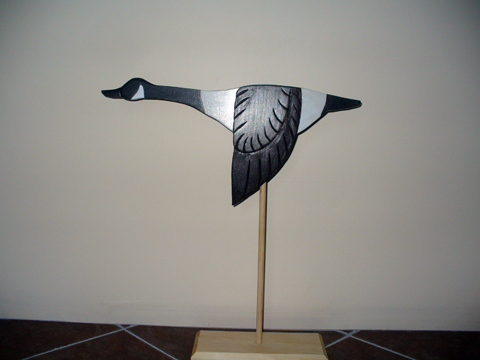 A Carved Flying Canada Goose