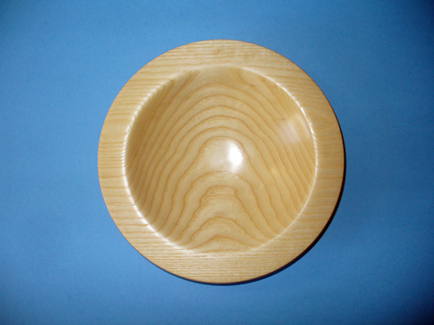 An Ash Bowl With A Flanged Rim