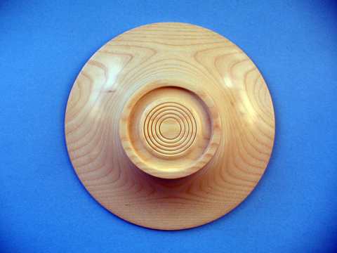 An Ash Bowl With A Flanged Rim